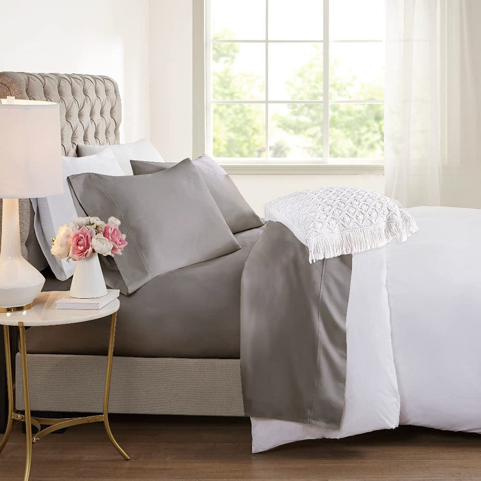 Cooling bamboo sheet set in grey, made up on a bed with matching pillowcases